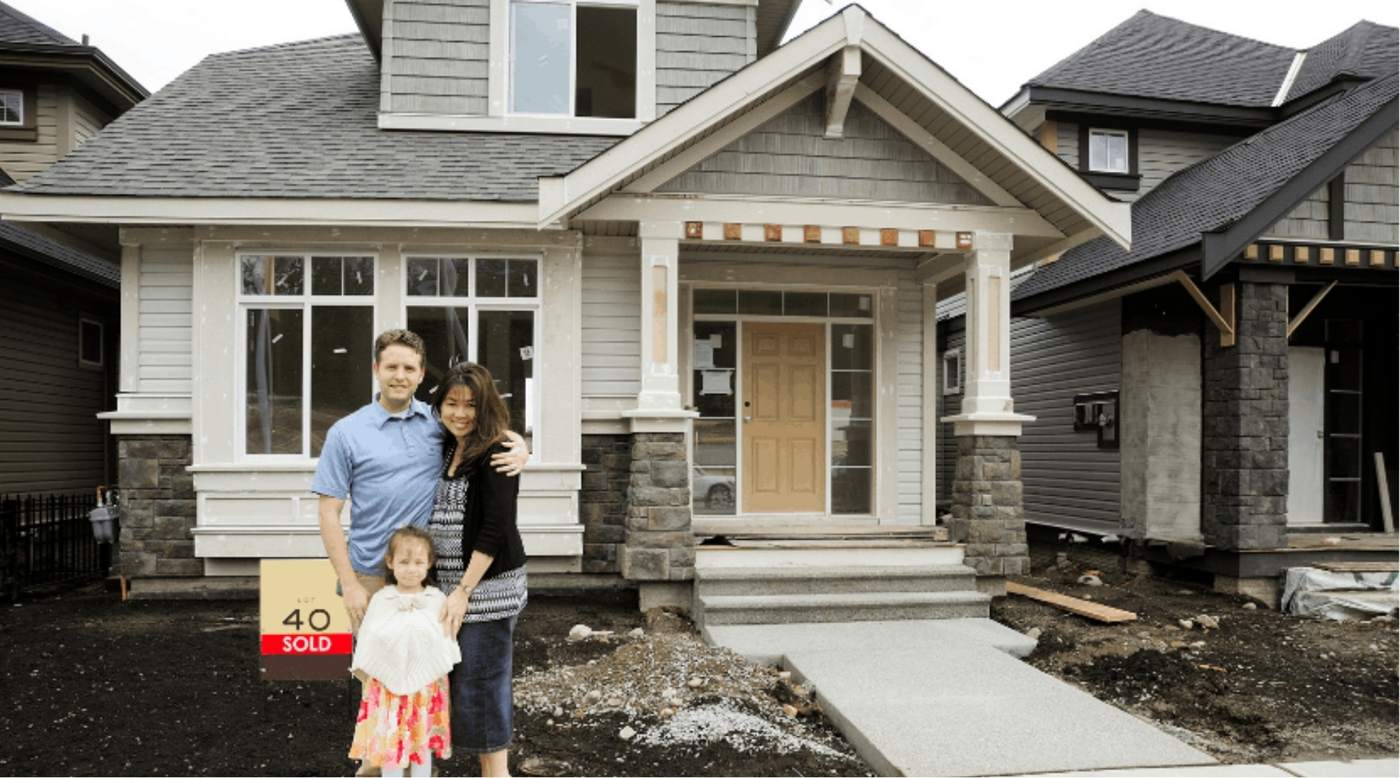 family standing outside newly purchased home