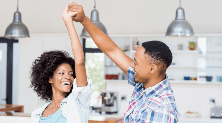 couple celebrating homeownership success after mortgage approval