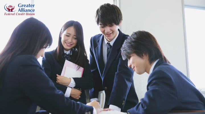 high school students collaborating on classwork
