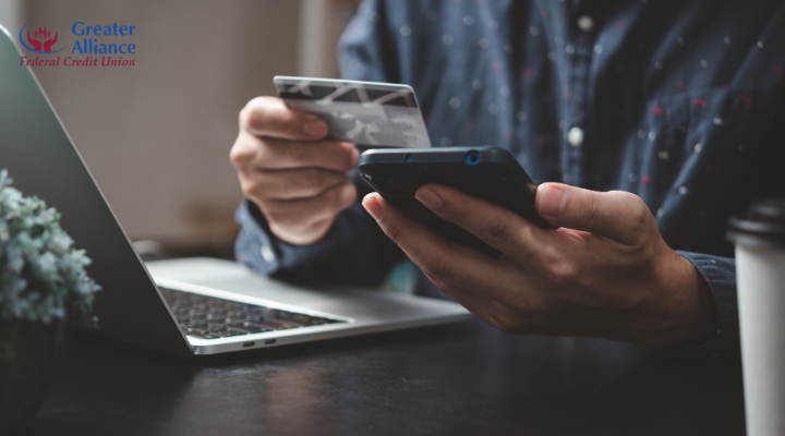 person using credit card and smartphone for online banking